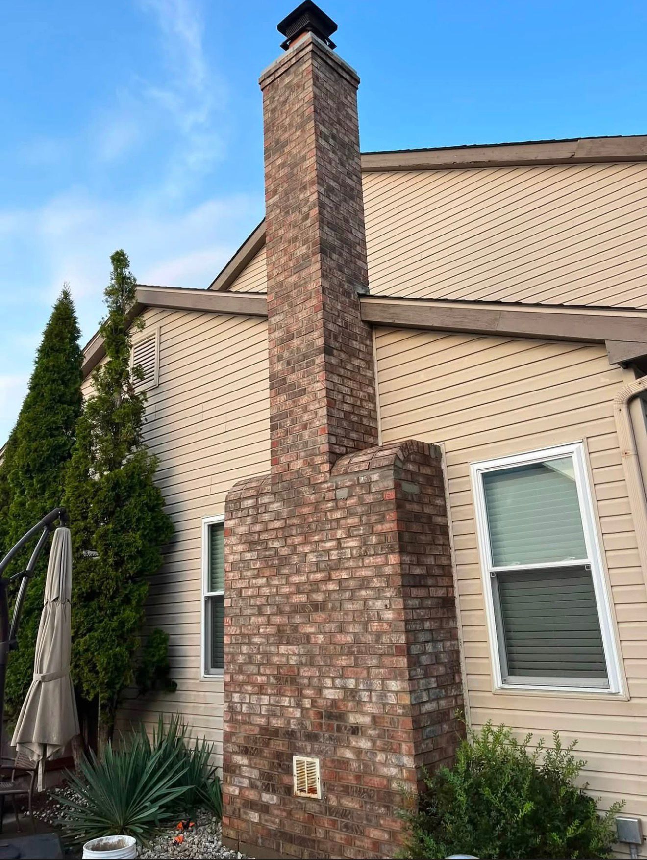 Restored full-height brick chimney on a Cincinnati home