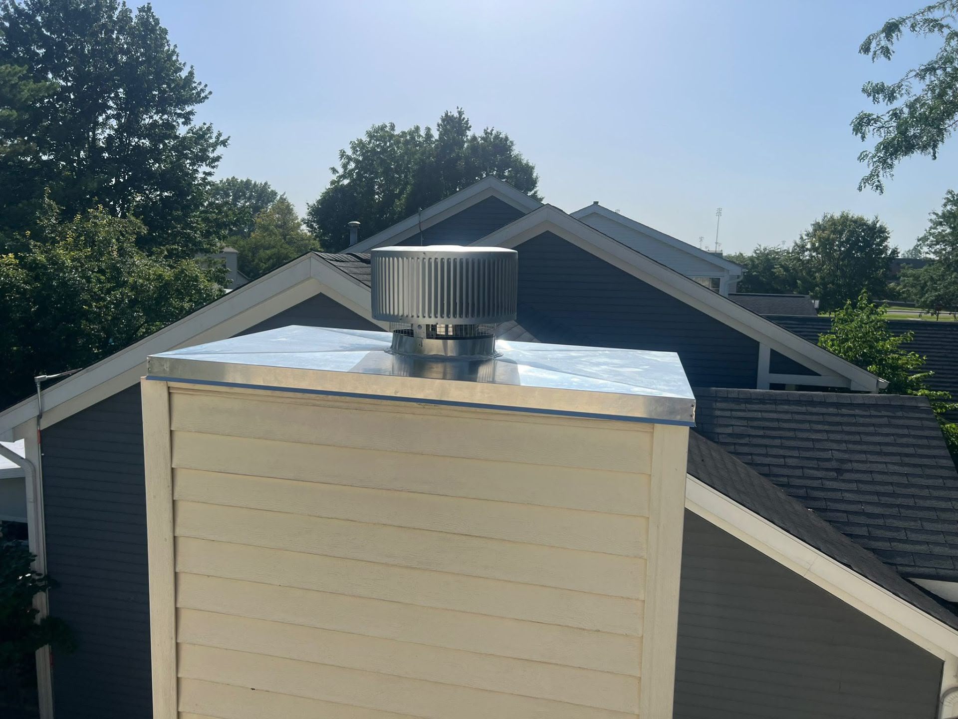 New stainless chase cover and cap installed on a Cincinnati chimney chase
