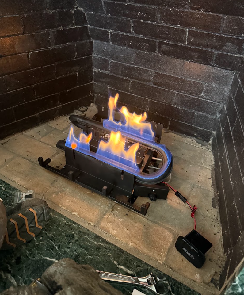 Gas burner running with clean blue and yellow flames after service